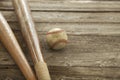 Old baseball and bats on rough wood surface Royalty Free Stock Photo