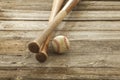 Old baseball and bats on rough wood surface Royalty Free Stock Photo