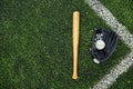 Old baseball glove and bat on field Royalty Free Stock Photo