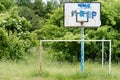 Old basketball court, basket, snatched netting against the sky Royalty Free Stock Photo