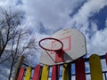 old basketball hoop against a background of blue sky and clouds Royalty Free Stock Photo