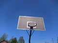 old basketball hoop on blue sky background Royalty Free Stock Photo
