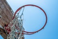 Old Basketball Hoop With Torn Net