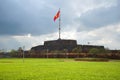 Old Bastion of the fortress city of Hue with waving national flag. Vietnam