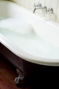 Old bath tube with bubbles Royalty Free Stock Photo