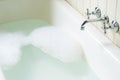 Old bath tube with bubbles Royalty Free Stock Photo