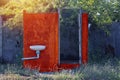 The old bathroom is in disrepair. Within the meadow Royalty Free Stock Photo