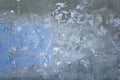 Old battered gray blue concrete wall with scratches and white paint stains. rough surface texture Royalty Free Stock Photo