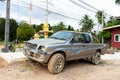 Old battered pickup truck parked near the house. Rural transport