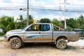 Old battered pickup truck parked near the house. Rural transport