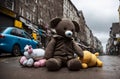 Old and battered soft toys lie on the street. The dump of the abandoned toys. Generative AI.