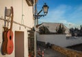 An old battered Spanish guitar hangs outside a bar in the Sacromonte district,Granada,Andalucia,Spain.