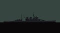 Old battleship in the ocean at night.