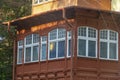 Old bay window balcony in wooden house. Selective focus, fog view Royalty Free Stock Photo