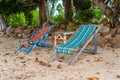 Old beach chairs in the sand on Samui island in Thailand Royalty Free Stock Photo