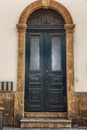 Old beautiful blue wooden door in the house. Front view. Vertical Royalty Free Stock Photo