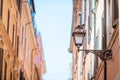 Old beautiful empty streets in Rome, Italy. Close-up of a street light at the town house Royalty Free Stock Photo