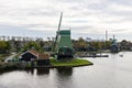 Beautiful Green Windmills along the Zaan River in Zaanse Schans Netherlands