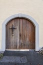 Old and beautiful ornate door with cross decoration Royalty Free Stock Photo