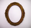 An old beautiful oval wooden frame with no photo or picture on a white background Royalty Free Stock Photo