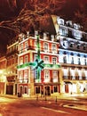 Old beautiful red building with a green bow on Liberty avenue in Lisbon