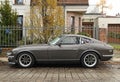 Old beautiful veteran vintage oldtimer sports car Datsun 240Z or Nissan Fairlady Z 1970 s parked