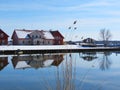 Old village Minge and river in winter, Lithuania Royalty Free Stock Photo