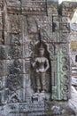 Murals and sculptures of vishnu, shiva, hindu god symbol, face in ancient temple ruins of angkor wat, cambodia