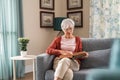 Senior woman reading book at home Royalty Free Stock Photo