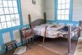 Old Bed with Comforter in Pioneer Tavern