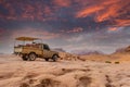 Old bedouin car with sandstones sunset landscape of Wadi Rum desert Royalty Free Stock Photo