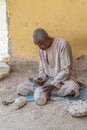 Old Bedouin man work handmade specific traditional stone objects. Luxor, Egypt