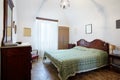 Old bedroom with queen double bed in ancient house Royalty Free Stock Photo