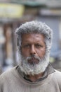 Old beggar man on the street in Srinagar, Jammu and Kashmir state, India. Poverty is a major issue in India