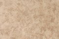 An old beige concrete wall background. A painted plaster wall texture. Royalty Free Stock Photo