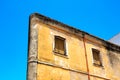 Old, beige house facade with closed shutters Royalty Free Stock Photo