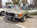 Old beige 1980 Mercedes Benz SLC C107 coupe in a park. AAA 2022 classic car show.