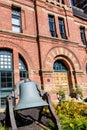 Old Bell by Brick Building Royalty Free Stock Photo