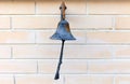 Old bell on brick wall, home decor Royalty Free Stock Photo