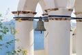 Old bell in a Greek church tower with view on the sea in Oia, Santorini, Greece Royalty Free Stock Photo