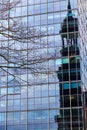 Old bell tower of St. Michael\'s Church reflects in modern office building in Hamburg, Germany Royalty Free Stock Photo