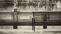 Old bench with river and tree at the background Royalty Free Stock Photo