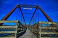 Old bentonsport truss highway bridge with the Mason house inn beyond