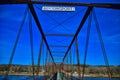 Old bentonsport truss highway bridge with the Mason house inn beyond