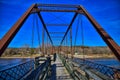 Old bentonsport truss highway bridge with the Mason house inn beyond