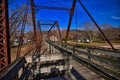 Old bentonsport truss highway bridge with the Mason house inn beyond