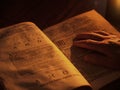 Old bible by candlelight Royalty Free Stock Photo