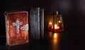 Old bible on a table with candle light Royalty Free Stock Photo