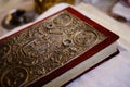 An old bible with two white gold rings on it Royalty Free Stock Photo