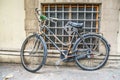 Old bicycle against a rustic wall Royalty Free Stock Photo